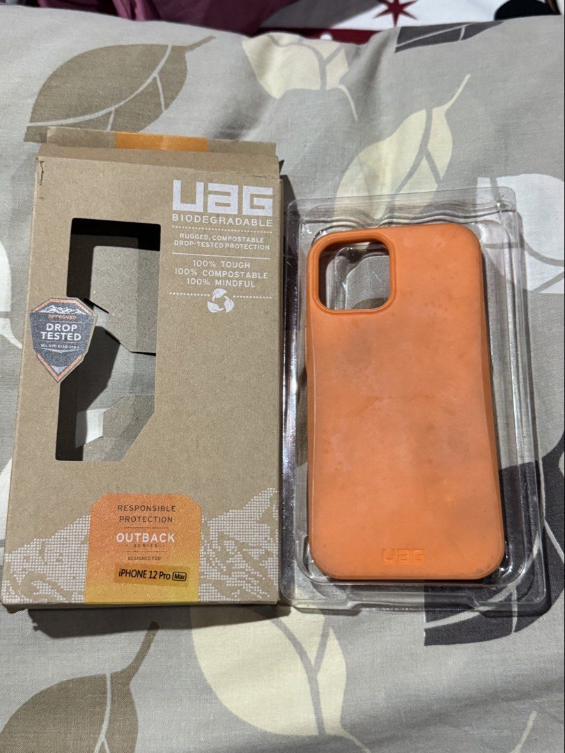 UAG Ip 12 Pro Max Case (Category: Cases & Sleeves) located in Obando. Submitted by pepperooshop (Listing ID 1459713837, Image 1). Description: - Brand: UAG - Model: iPhone 12 Pro Max - Color: Orange - Feature: Biodegradable & Compostable - Protection: Rugged, drop-tested - Condition: New (in packaging) - - Iph 12 pro max -rfs:decluttering.