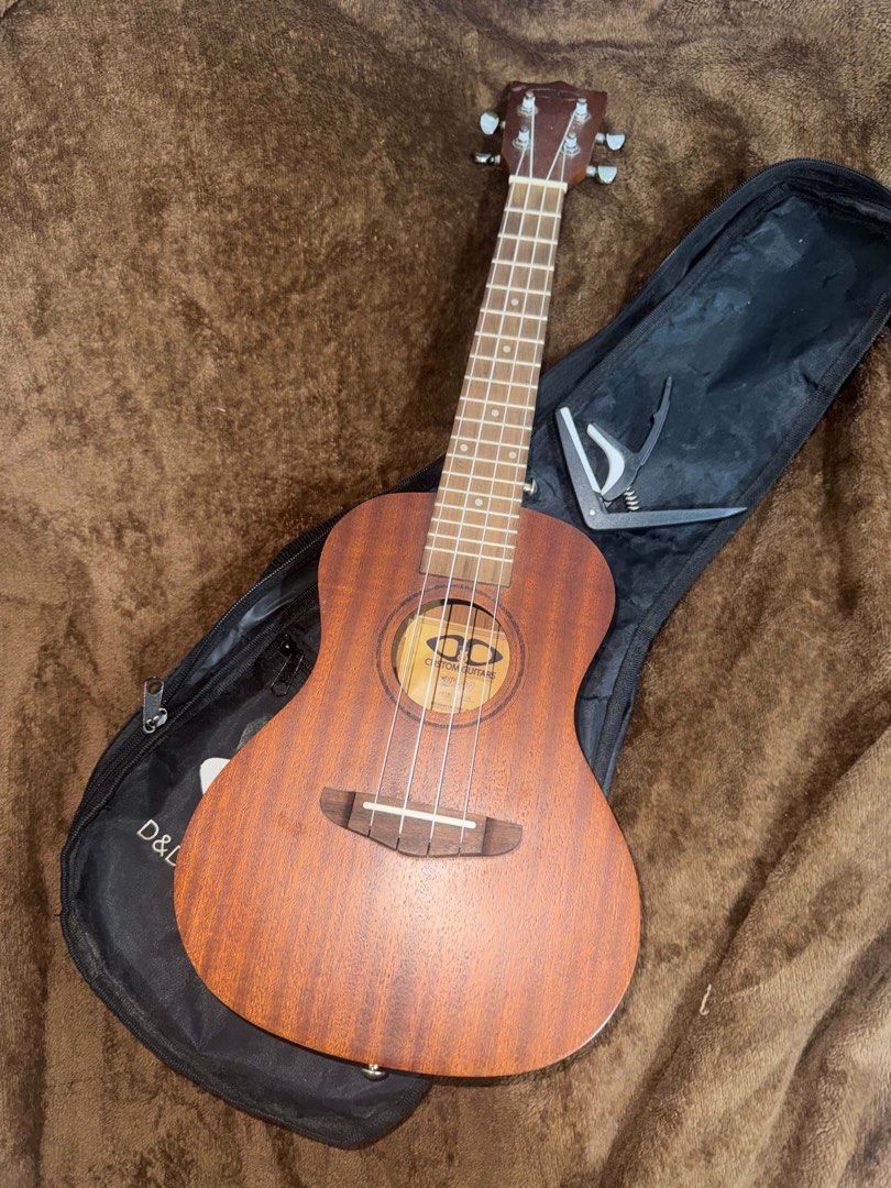 Ukelele with Capo (Category: Musical Instruments) located in Manila. Submitted by soteriya_ (Listing ID 1459772954, Image 1). Description: Selling my Ukelele with capo and bag.