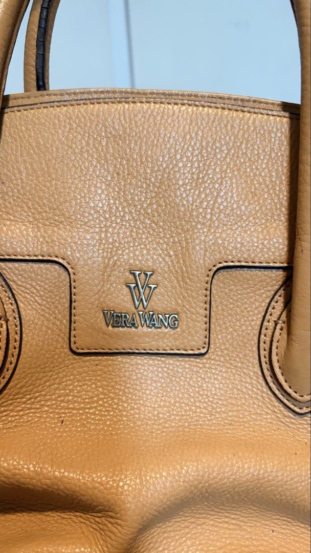 Vera Wang two-way Handbag (Category: Cross-body Bags) located in Quezon City. Submitted by abiclarisse (Listing ID 1459764085, Image 2). Description: Authentic Vera Wang 2-way handbag in tan/caramel. Can be used as a handbag or shoulder/crossbody bag. Good overall condition with only minimal scratches/signs of use. No major damage or issues. Complete with adjustable/detachable shoulder strap. Selling for ₱1,500 negotiable. RFS: Decluttering Pleas