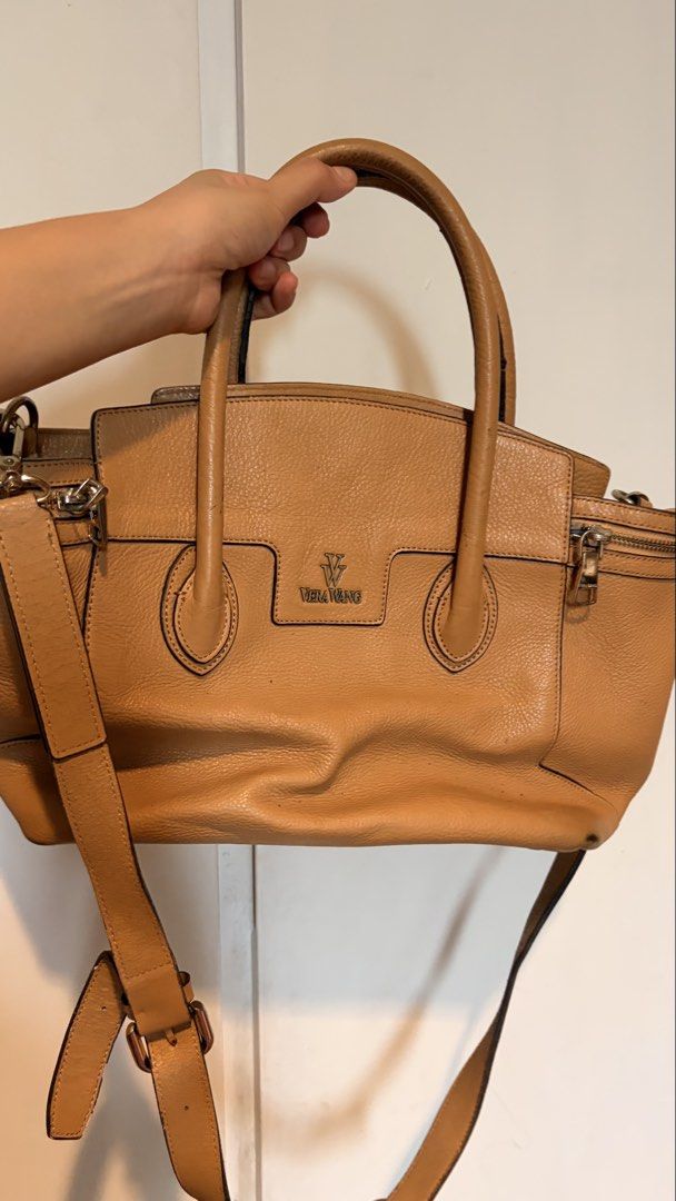 Vera Wang two-way Handbag (Category: Cross-body Bags) located in Quezon City. Submitted by abiclarisse (Listing ID 1459764085, Image 1). Description: Authentic Vera Wang 2-way handbag in tan/caramel. Can be used as a handbag or shoulder/crossbody bag. Good overall condition with only minimal scratches/signs of use. No major damage or issues. Complete with adjustable/detachable shoulder strap. Selling for ₱1,500 negotiable. RFS: Decluttering Pleas