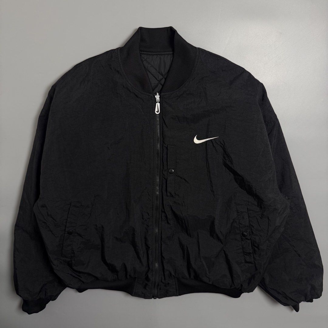 Vintage 90s Nike Black Reversible Bomber Jacket (Category: Coats, Jackets and Outerwear) located in Cebu City. Submitted by inukaybyjlf (Listing ID 1459690068, Image 2). Description: Condition: Excellent Issue: Small tear check last photo Dimension: 28x27.5 Best fit: XL Please refer to photos for actual condition..