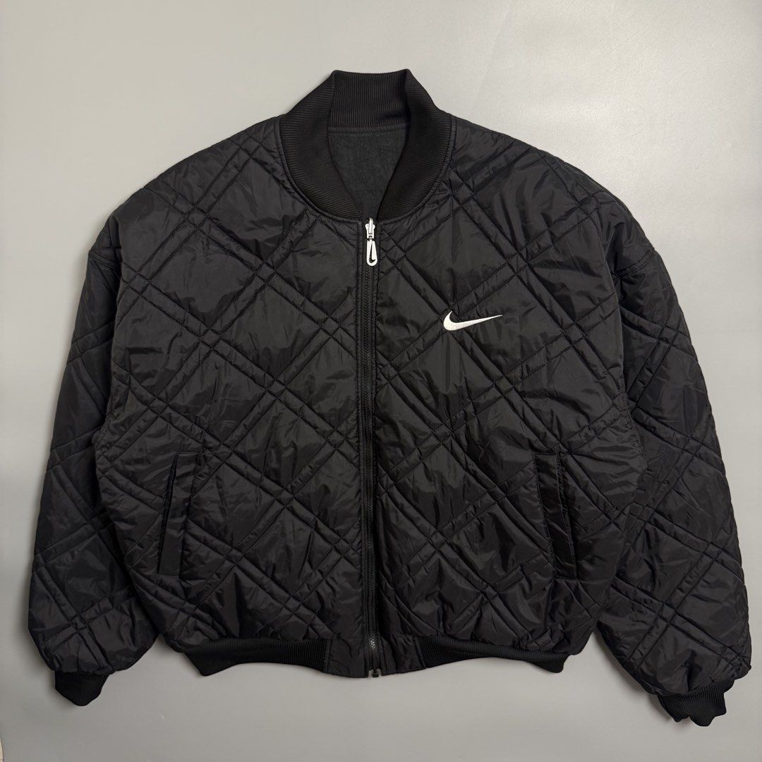 Vintage 90s Nike Black Reversible Bomber Jacket (Category: Coats, Jackets and Outerwear) located in Cebu City. Submitted by inukaybyjlf (Listing ID 1459690068, Image 1). Description: Condition: Excellent Issue: Small tear check last photo Dimension: 28x27.5 Best fit: XL Please refer to photos for actual condition..