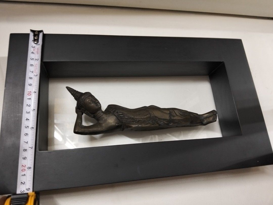 Vintage Brass Decor (Category: Other Home Decor) located in Manila. Submitted by raymundm36884 (Listing ID 1459869338, Image 1). Description: - Bronze reclining Buddha statue - Mounted in a black frame - Approximately 9 inches in length - Ideal for home decor or meditation spaces - Unique find.