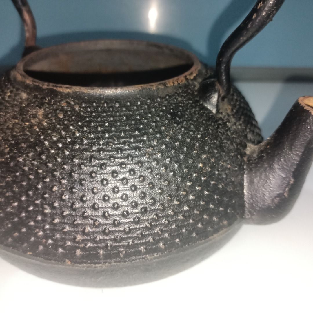 Vintage Cast Iron Teapot Kettle Medium Size (Category: Coffee & Tea Tableware) located in Munoz. Submitted by larryc1212 (Listing ID 1459821571, Image 1). Description: - Classic cast iron teapot - Unique textured exterior - Sturdy handle and spout - Ideal for tea lovers or as a decorative piece - Vintage charm with signs of age and use - Approximately 7.5 inches tall (including handle) Disclaimer: Item may include some scratches due to age, as is