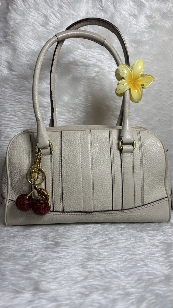 Vintage Coach Pebbled Leather Satchel (Category: Shoulder Bags) located in Manila. Submitted by vintage_og_bagash (Listing ID 1459834714, Image 1). Description: Vintage Coach Pebbled Leather Satchel Details: • Brand: Coach • Model: Pebbled Leather Satchel • Color: Off-White • Material: Genuine pebbled leather • Gold-tone hardware • Dual rolled leather handles • Top zip closure • Spacious main compartment • Interior zip pocket • Interior multifunc