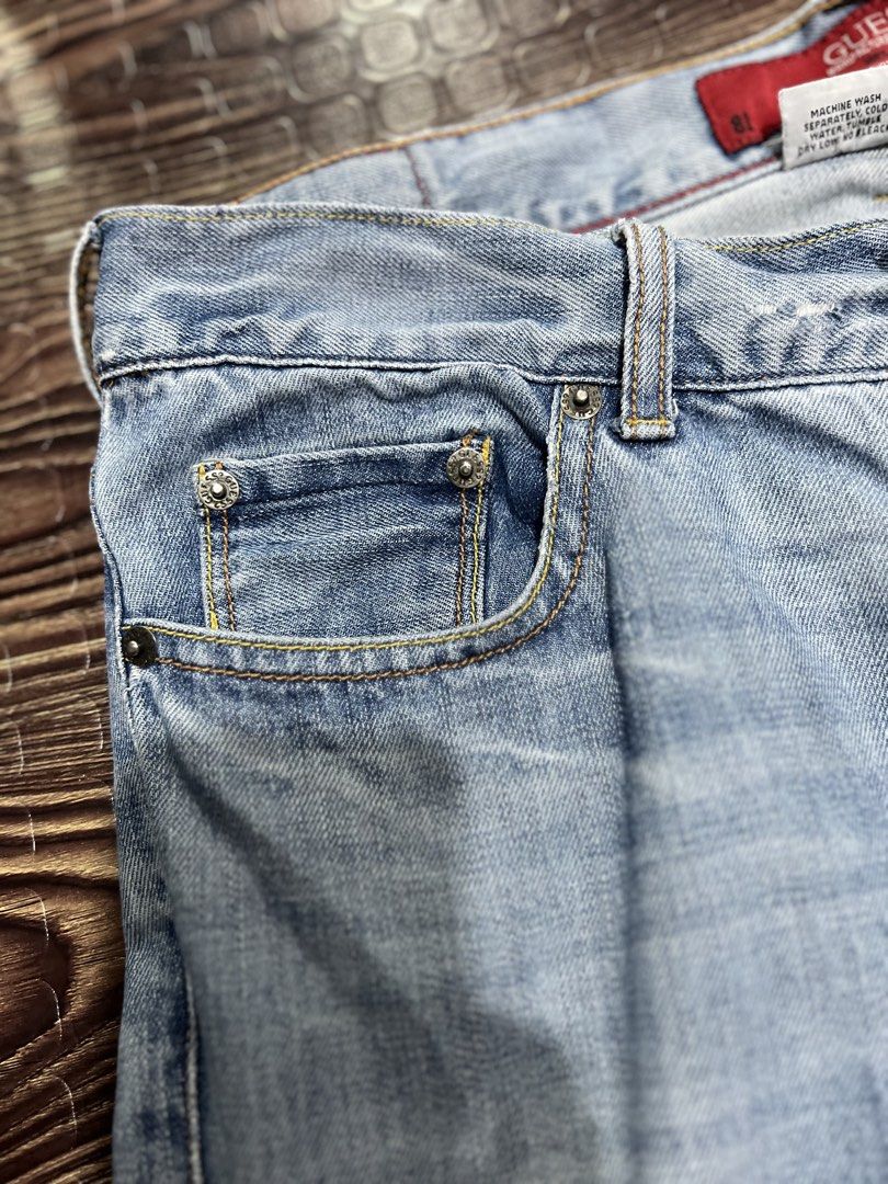 Vintage Guess y2k (Category: Jeans) located in Manila. Submitted by okeanos (Listing ID 1459759636, Image 2). Description: - Light wash Guess Jeans - Size 31 - Distressed and ripped legs (as pictured) - Classic denim style - Embroidered back pockets - Button fly closure - Ideal for a casual look.