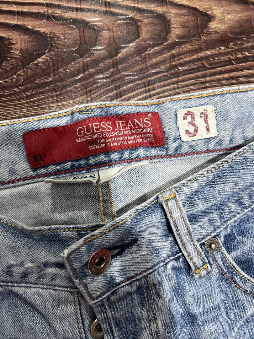 Vintage Guess y2k (Category: Jeans) located in Manila. Submitted by okeanos (Listing ID 1459759636, Image 3). Description: - Light wash Guess Jeans - Size 31 - Distressed and ripped legs (as pictured) - Classic denim style - Embroidered back pockets - Button fly closure - Ideal for a casual look.