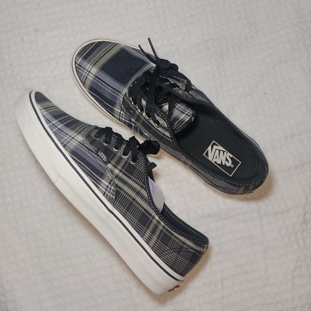 Vintage Vans Authentic Plaid Mule Sneakers (Category: Sneakers) located in Mabitac. Submitted by kitothrifty (Listing ID 1459838099, Image 1). Description: - Cool Vans plaid mules - Easy slip-on style - Plaid pattern: grey, white, dark blue tones - Black laces and white soles - Great for casual wear - Fun twist on classic Vans look.