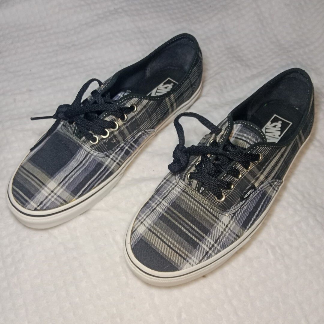 Vintage Vans Authentic Plaid Mule Sneakers (Category: Sneakers) located in Mabitac. Submitted by kitothrifty (Listing ID 1459838099, Image 3). Description: - Cool Vans plaid mules - Easy slip-on style - Plaid pattern: grey, white, dark blue tones - Black laces and white soles - Great for casual wear - Fun twist on classic Vans look.