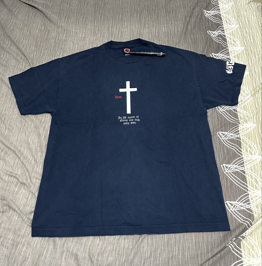 Vintage Zero Skateboards Jamie Thomas (Category: Tshirts & Polo Shirts ) located in Bacoor. Submitted by realbacktrack (Listing ID 1459697282, Image 1). Description: - Navy blue Zero t-shirt - Features a white cross graphic with 'Zero' in red - Text below reads 'In the name of God's one and only son.' - Zero logo on the sleeve - From the Tum-Yeto brand - Ideal for skateboarders and fans *23.5 x 29.7 Hairlines 9/10 color rate *color may vary due t