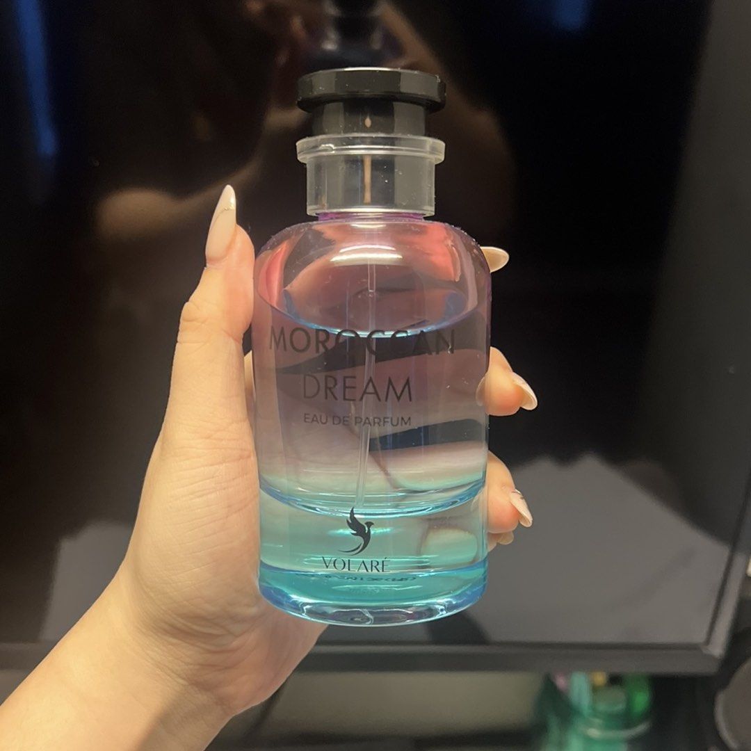 Volare Moroccan Dream Eau de Parfum (Category: Fragrance & Deodorants) located in Makati City. Submitted by amichicloset (Listing ID 1459816171, Image 1). Description: - Moroccan Dream Eau de Parfum by Volare - Stunning ombre bottle with a pink to blue gradient - Captivating and amazing scent - Versatile for everyday wear or special occasions -95% Full (barely used ) // No box.
