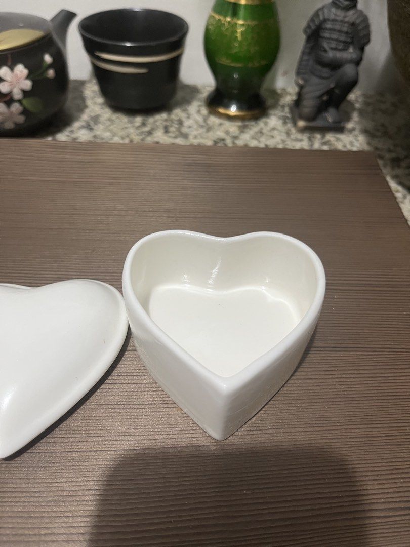 White Ceramic Heart Shaped Ring Dish Trinket with box (Category: Rings) located in Taguig. Submitted by minmin_parker (Listing ID 1459852518, Image 3). Description: - Adorable heart-shaped ceramic dish - Features a lid to keep your treasures safe - Ideal for storing rings, earrings, or small trinkets - Adds a touch of charm to your bedside table or dresser - Clean and simple design.