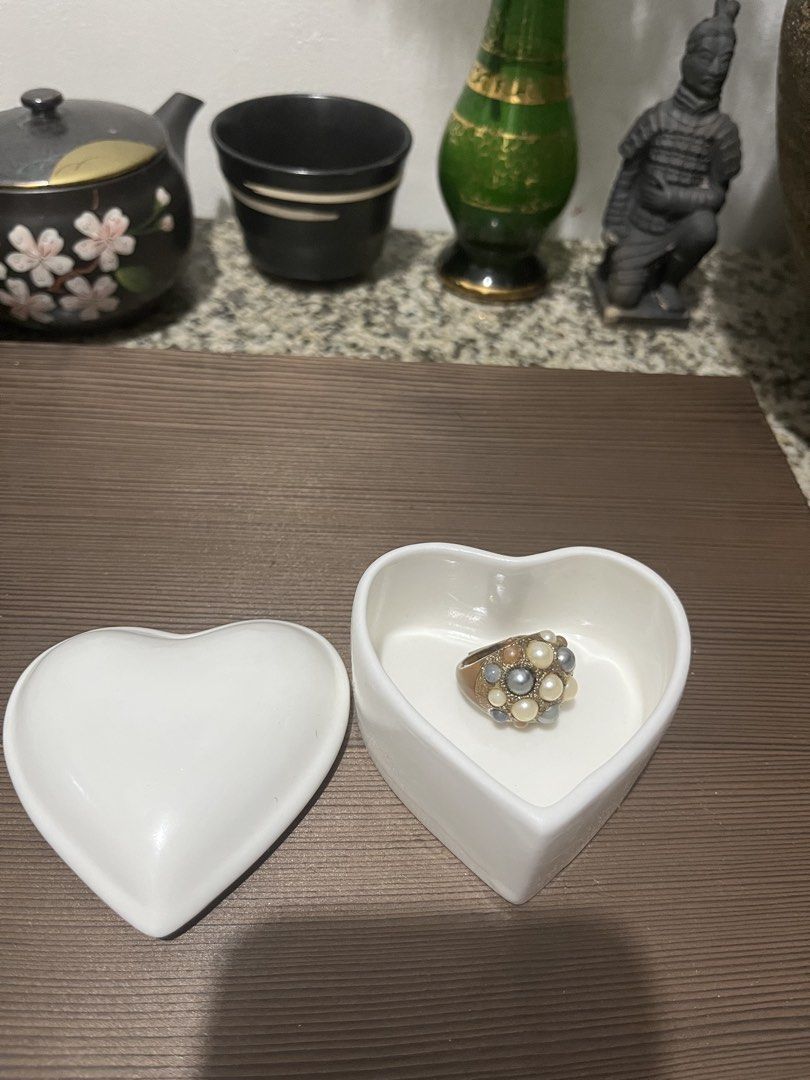 White Ceramic Heart Shaped Ring Dish Trinket with box (Category: Rings) located in Taguig. Submitted by minmin_parker (Listing ID 1459852518, Image 1). Description: - Adorable heart-shaped ceramic dish - Features a lid to keep your treasures safe - Ideal for storing rings, earrings, or small trinkets - Adds a touch of charm to your bedside table or dresser - Clean and simple design.