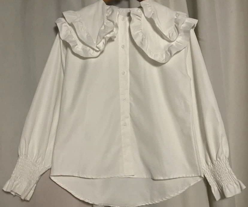White Double Ruffle Collar Shirt Longsleeve (Category: Shirts) located in Caloocan City. Submitted by declutteringph. (Listing ID 1459729564, Image 2). Description: No Size on the tag! Measurements: (inches) shoulder: 18” pit to pit: 21” length: 22.5” - 27” sleeve length: 23.5”.
