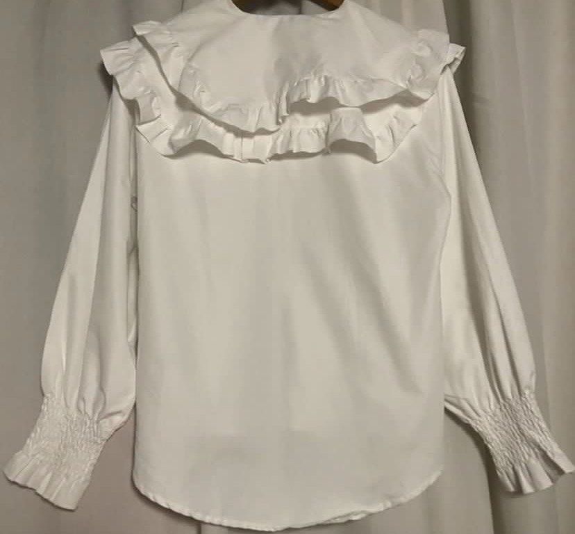 White Double Ruffle Collar Shirt Longsleeve (Category: Shirts) located in Caloocan City. Submitted by declutteringph. (Listing ID 1459729564, Image 3). Description: No Size on the tag! Measurements: (inches) shoulder: 18” pit to pit: 21” length: 22.5” - 27” sleeve length: 23.5”.
