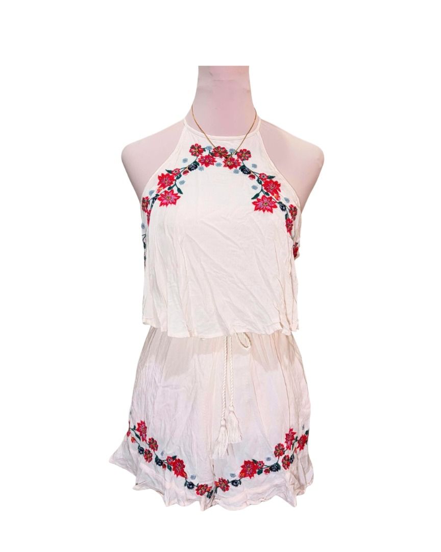 White Embroidered Halter Neck Romper with Tassels (Category: Rompers) located in Baguio. Submitted by ellamell (Listing ID 1459774440, Image 1). Description: Best fits XS-S 40cm bust 30-40cm waist 79cm length/height - White halter neck romper - Garterized waist - Beautiful floral embroidery on top and hem - Drawstring waist with tassel detail - Adjustable back ties - Lightweight and flowy material - Ideal for beach days or casual outings.