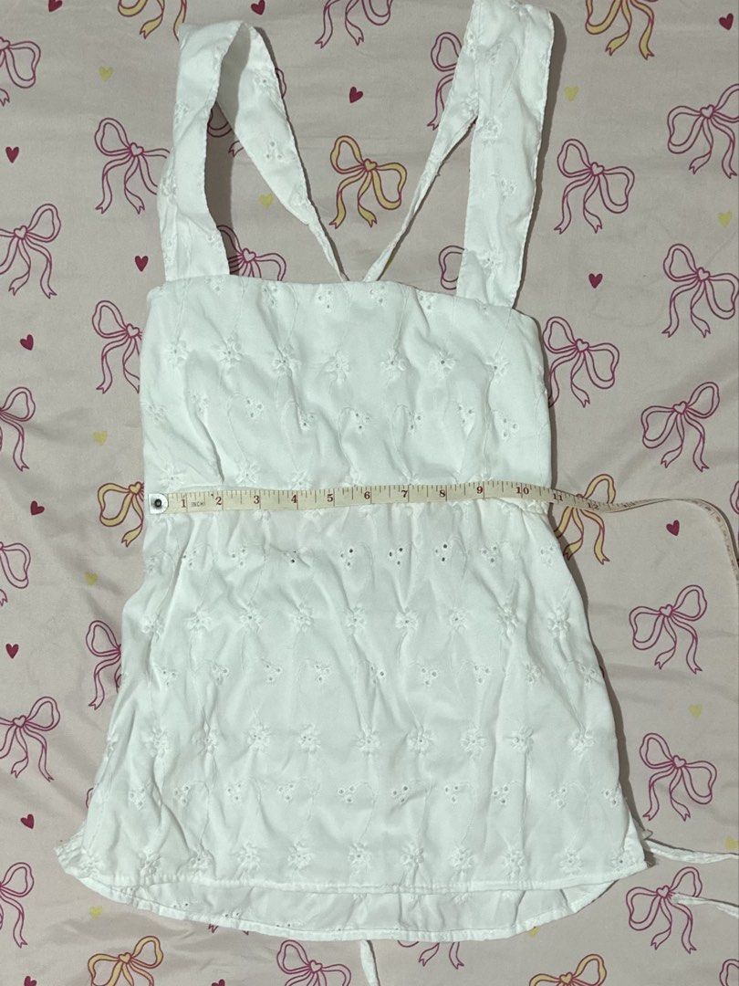 White halter eyelet top (Category: Blouses) located in Daet. Submitted by 614cb (Listing ID 1459718857, Image 1). Description: Bought in black app live selling from nkd shop Never been used Rfs: been wfh and seldom goes out and enjoying it. Pls give my stuff a new home. .