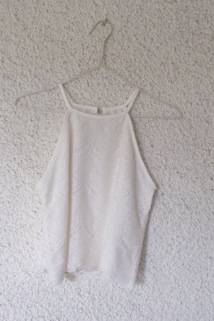White Lace Halter Neck Crop Top (Category: Sleeveless) located in Caloocan City. Submitted by kccloset_ (Listing ID 1459802419, Image 1). Description: Cute white lace crop top. Halter neck style with a subtle pattern all over. Looks great paired with high-waisted bottoms. Perfect for a night out or a casual day. Easy to style..
