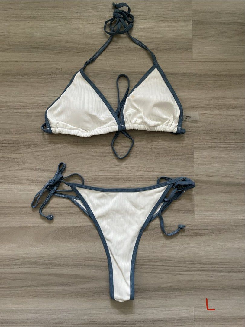 White Ribbed Bikini with Blue Trim - Size L (Category: Bikinis & Swimsuits) located in Manila. Submitted by possiblymaybe.717 (Listing ID 1459783229, Image 1). Description: - Cute white ribbed bikini - Blue trim detail - Halter top with adjustable ties - Bottoms with adjustable side ties - Size L - Perfect for beach or pool - Brand new, never worn, with tags attached.