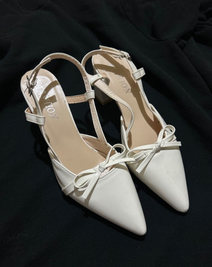 White Slingback Heels with Bow Detail (Category: Heels) located in Manila. Submitted by tyluvbot (Listing ID 1459855494, Image 3). Description: - Elegant white slingback heels - Stylish pointed toe with a charming bow detail - Adjustable strap at the back for a secure and comfortable fit - Stable and comfy block heel - Only used once for an avent!!!.