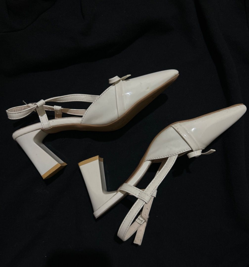 White Slingback Heels with Bow Detail (Category: Heels) located in Manila. Submitted by tyluvbot (Listing ID 1459855494, Image 2). Description: - Elegant white slingback heels - Stylish pointed toe with a charming bow detail - Adjustable strap at the back for a secure and comfortable fit - Stable and comfy block heel - Only used once for an avent!!!.