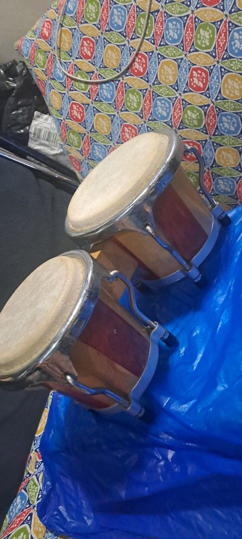 Wooden Bongo Drums with Metal Hardware (Category: Musical Instruments) located in Quezon City. Submitted by chrisconradbautista (Listing ID 1459744480, Image 3). Description: - Pair of wooden bongo drums - Natural wood finish with contrasting stripes - Metal hardware and tension rods - Small size, ideal for beginners or practice - Produces a great sound - Ready for a new home Mini Bongo Drums Japan In very good condition sizes shown on pictures s