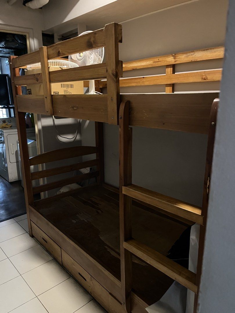Wooden Bunk Bed with Drawers (Category: Bed Frames & Mattresses) located in Taguig. Submitted by anina.anina (Listing ID 1459801651, Image 2). Description: Solid Mahogany wood bunk bed for sale. Custom made. Very sturdy. Great space-saving solution. - Includes ladder for top bunk - Bottom bunk features built-in storage drawers - Natural wood finish - Parts may be dismantled Some cosmetic damage mainly on the bottom plywood. Dimensions are: 203 cm