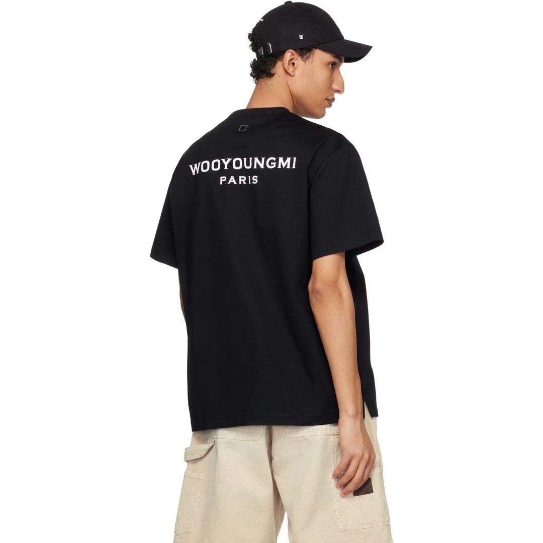 WOOYOUNGMI Black Script Logo T-Shirt (Category: Luxury Apparel) located in Lemery. Submitted by thesecond_row.ph (Listing ID 1459717764, Image 3). Description: WOOYOUNGMI Black Script Logo T-Shirt Authentic 48- Large fit 23” width 28” length As new condition No issue 10/10 color rate A korean luxury high-end brand originates in Paris. Sought after silhouette with its signature squared-metal and script logo at the back. They are also known for nic