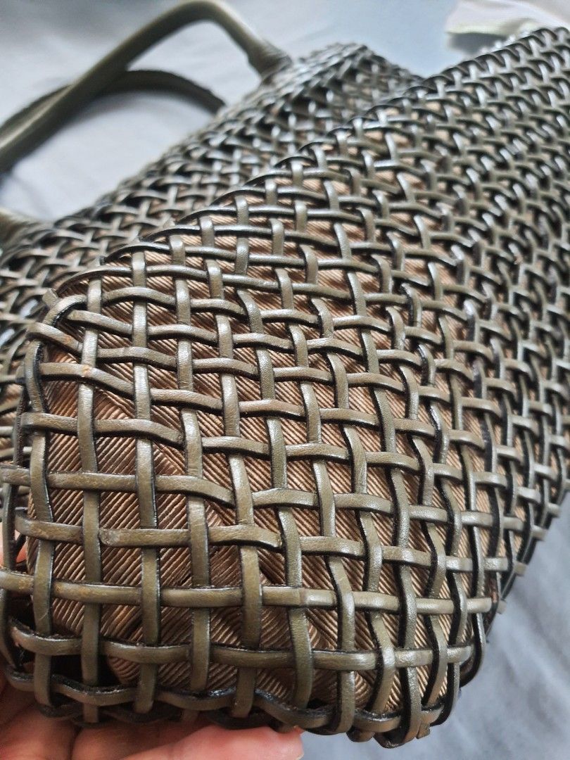 Woven Tote Bag with Leather Handles (Category: Tote Bags) located in Quezon City. Submitted by pinksgate31 (Listing ID 1459721127, Image 3). Description: - Chic woven tote bag - Neutral brown and grey color palette - Genuine leather handles - Secure zipper closure with magnetic snap button - Interior zippered pocket for essentials - Spacious design, ideal for everyday or travel Used only once. Dimes: 12x9x6 inches (wxhxbase) Location: QC.