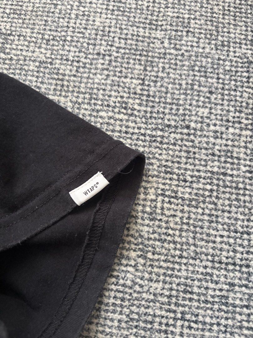 WTAPS (Category: Tshirts & Polo Shirts) located in Kulai. Submitted by apek_chaotic (Listing ID 1459842347, Image 3). Description: - Brand: WTAPS - Color: Black - Size: 3 (P22.5 L29) - Features: Classic WTAPS center logo - Condition: 9.5/10.