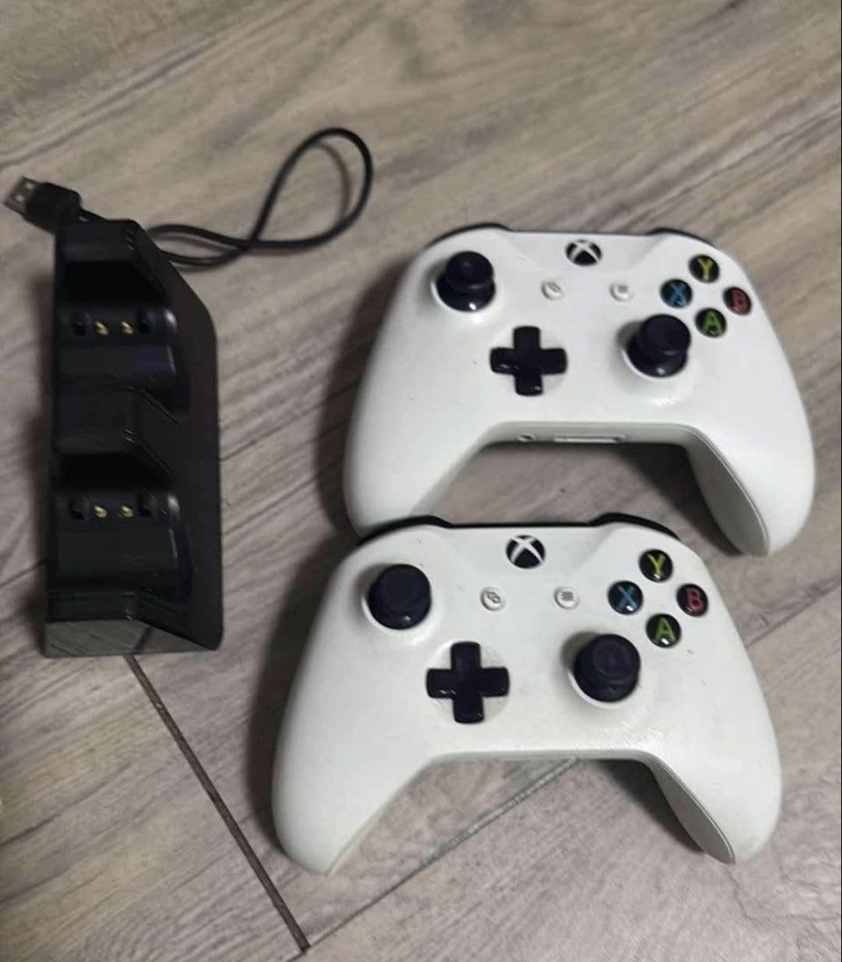 Xbox One S Console with 2 Controllers and Charging Dock (Category: Xbox) located in Taguig. Submitted by anne2189 (Listing ID 1459714201, Image 3). Description: - Xbox One S Console (White) 1TB - Two (2) White XBOX Wireless Controller, Chargeable battery - Dual Controller Charging Dock - All items shown in photos included - Ready for shipment included original box. - No Issue, Good as New. .