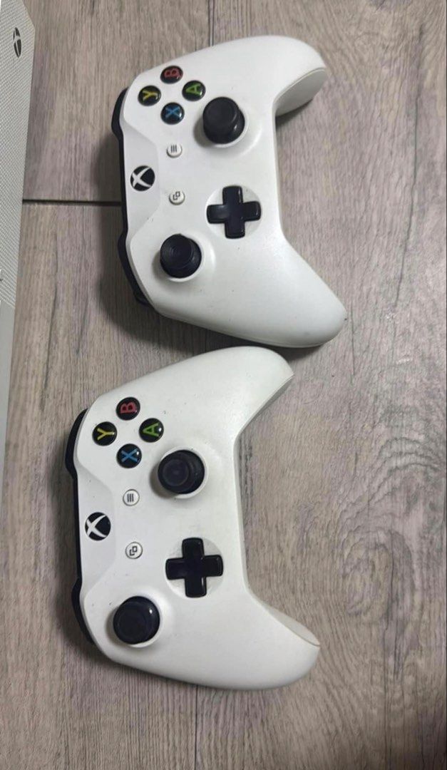 Xbox One S Console with 2 Controllers and Charging Dock (Category: Xbox) located in Taguig. Submitted by anne2189 (Listing ID 1459714201, Image 2). Description: - Xbox One S Console (White) 1TB - Two (2) White XBOX Wireless Controller, Chargeable battery - Dual Controller Charging Dock - All items shown in photos included - Ready for shipment included original box. - No Issue, Good as New. .