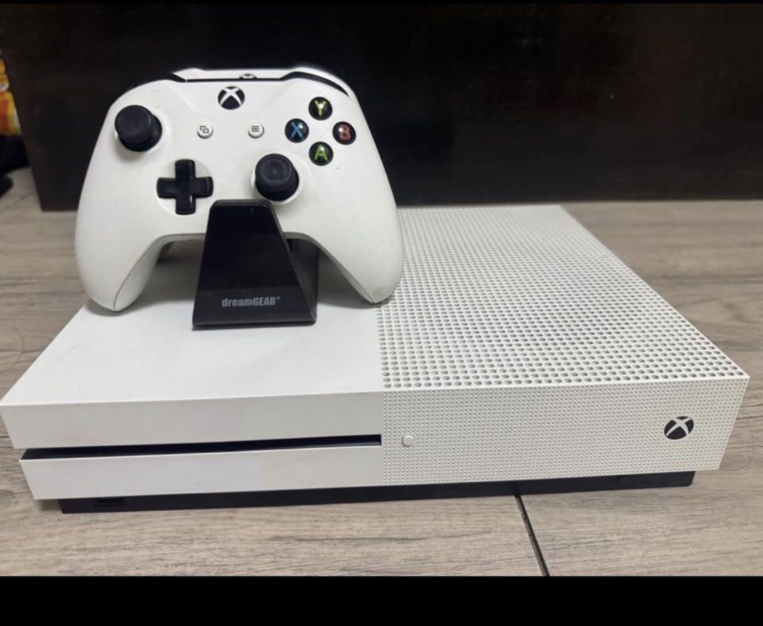 Xbox One S Console with 2 Controllers and Charging Dock (Category: Xbox) located in Taguig. Submitted by anne2189 (Listing ID 1459714201, Image 1). Description: - Xbox One S Console (White) 1TB - Two (2) White XBOX Wireless Controller, Chargeable battery - Dual Controller Charging Dock - All items shown in photos included - Ready for shipment included original box. - No Issue, Good as New. .