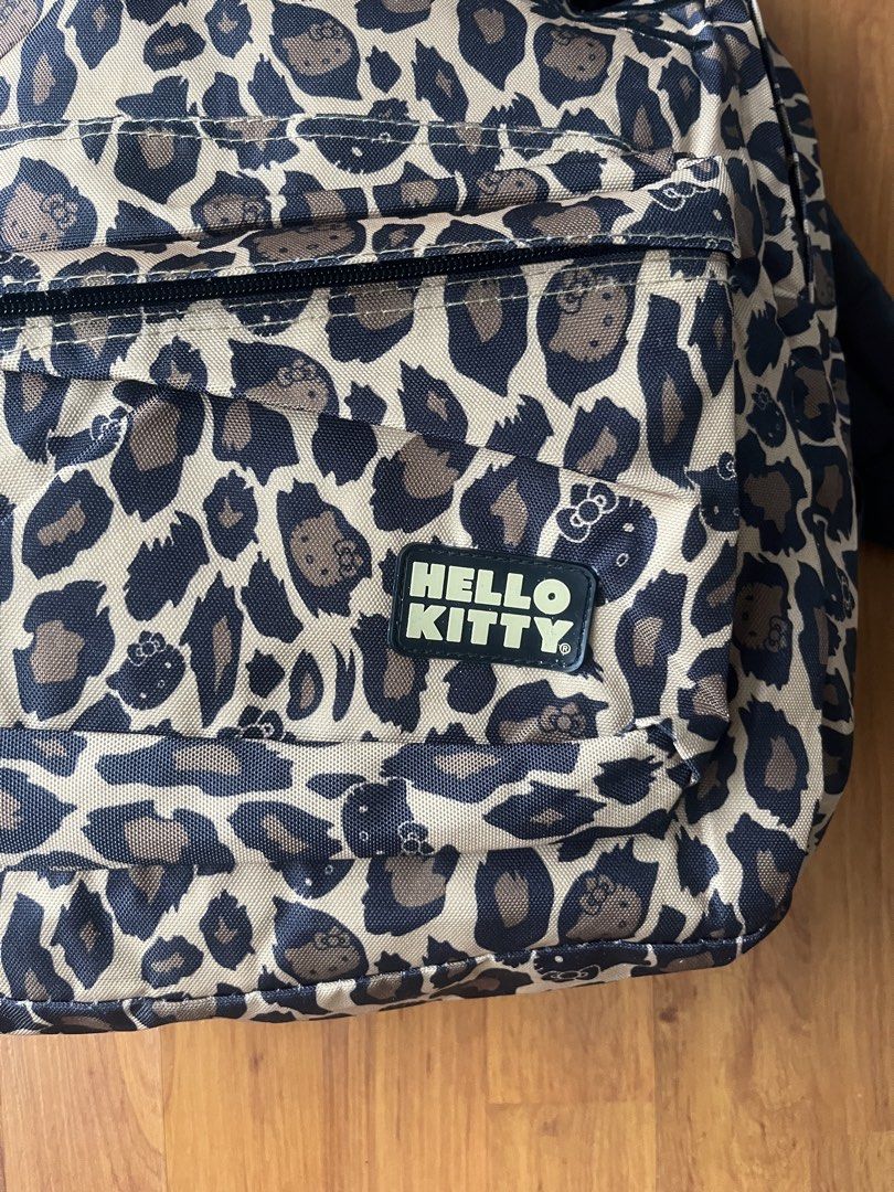 Y2K Loungefly x Hello Kitty Leopard Print Backpack (Category: Backpacks) located in Lipa City. Submitted by alexcollectionco (Listing ID 1459812069, Image 3). Description: Rare vintage Loungefly x Sanrio Hello Kitty leopard cheetah print canvas backpack featuring signature 3D kitty ears and black patent bow detail. Perfect y2k streetwear, alt, and coquette aesthetic school or daily bag. Key Features Official Sanrio x Loungefly collaboration tag A