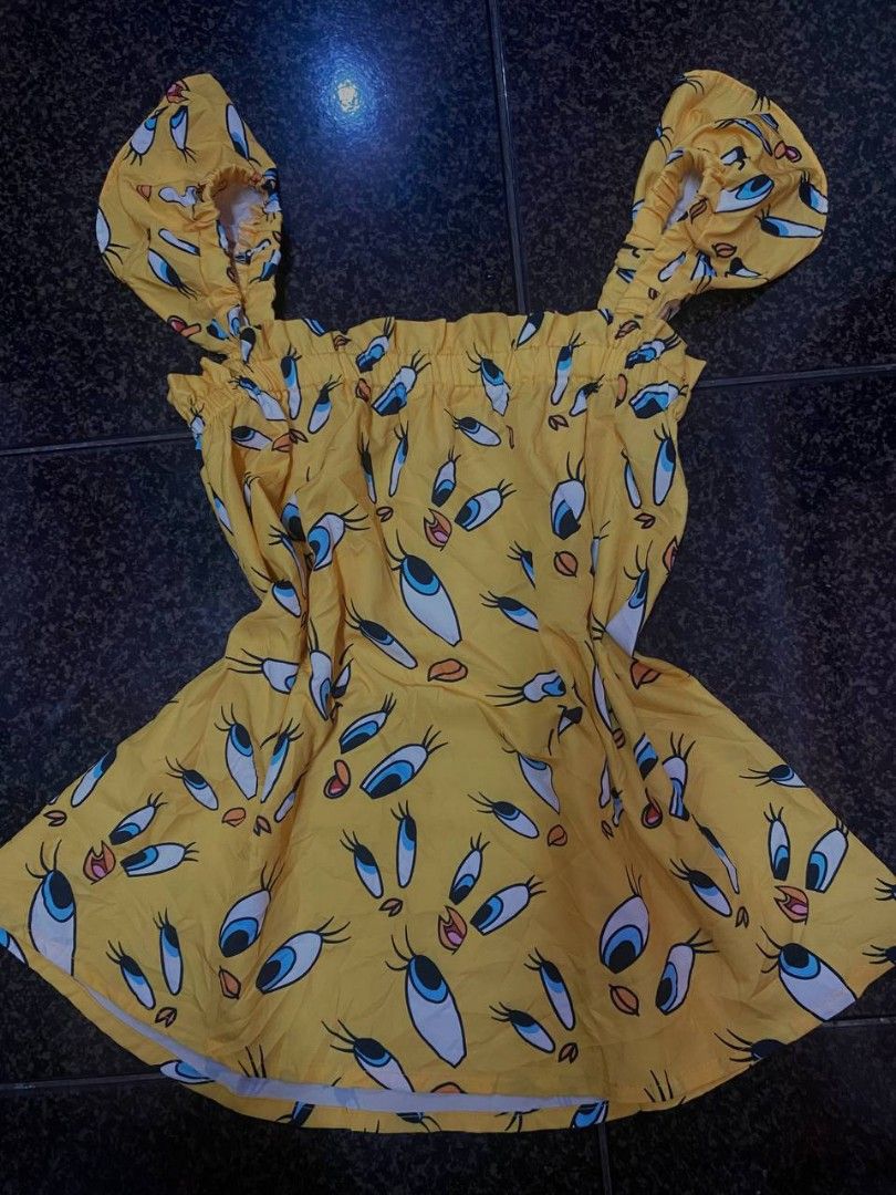 Yellow Tweety Bird Print Ruffle Top (Category: Sleeveless) located in Manila. Submitted by czn_hushley (Listing ID 1459818809, Image 1). Description: - Adorable yellow top featuring a fun all-over Tweety Bird print. - Stylish ruffled neckline adds a charming detail. - Comfortable flutter sleeves for a breezy feel. - Made from lightweight and flowy fabric. - Ideal for creating a casual and playful outfit. - Versatile: easily pairs with shorts or j