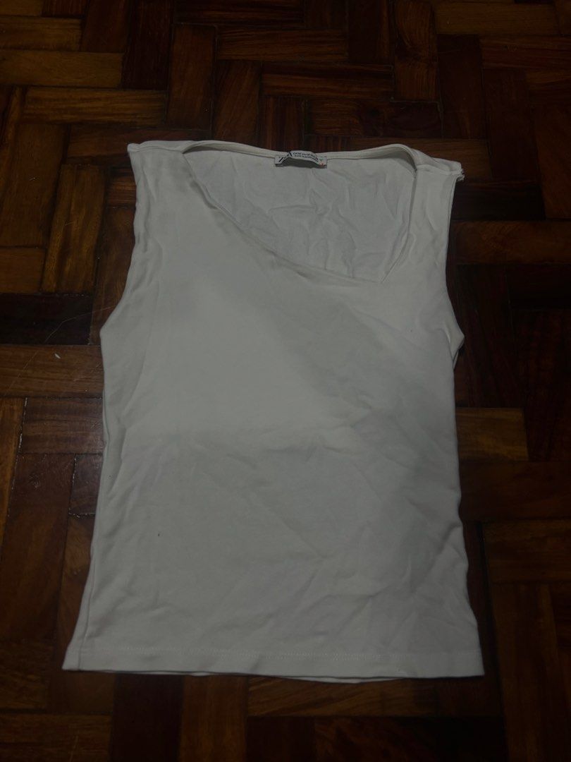 Zara Asymmetrical White Tank Top (Category: Others Tops) located in Quezon City. Submitted by chloe_declutter (Listing ID 1459763284, Image 1). Description: Open to pickup/j&t delivery Cubao QC location Still available 9/26 Code: Teal Box.