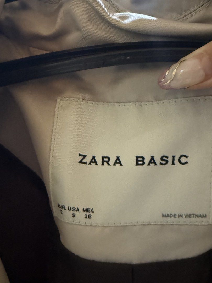Zara Basic Double Breasted Trench Coat Beige Size S (Category: Coats, Jackets and Outerwear) located in Makati City. Submitted by nemkd (Listing ID 1459723272, Image 2). Description: - Classic beige trench coat from Zara Basic - Double-breasted style with button closure - Adjustable straps on the cuffs - Made in Vietnam - Versatile for layering over any outfit.