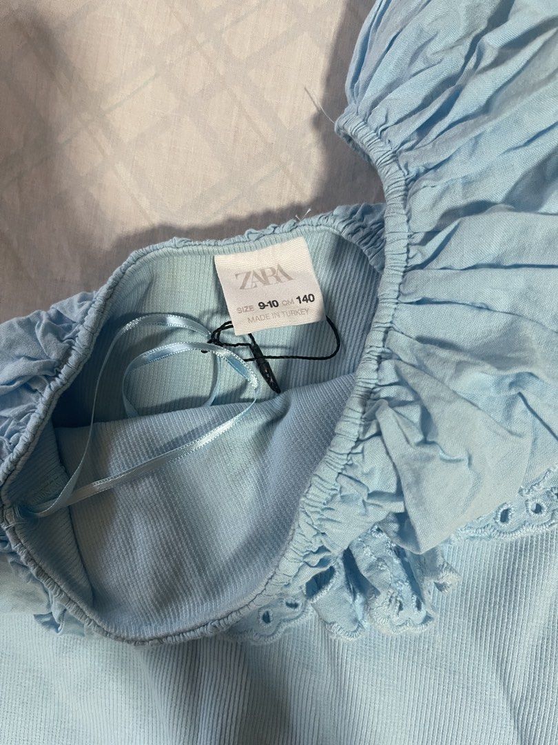 Zara Blue One Shoulder Eyelet Top (Category: Blouses) located in Quezon City. Submitted by lmo2911 (Listing ID 1459713856, Image 2). Description: Cute blue one-shoulder top from Zara never worn but removed the tag fits XS slight discoloration on the back but unnoticeable when worn on for more details about the product — QC based delivery fee to be shouldered by buyer .