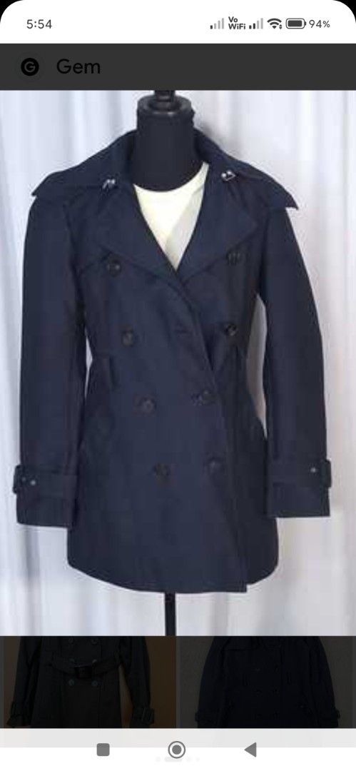 ZARA Double Breasted Navy Trench Coat (Category: Coats, Jackets and Outerwear) located in Cainta. Submitted by condoandstuff (Listing ID 1459793040, Image 1). Description: - Navy blue trench coat from ZARA - Double-breasted with button closure - Belted waist and adjustable cuffs - Classic trench details: epaulets and storm flap - Fully lined interior - Ideal for layering.