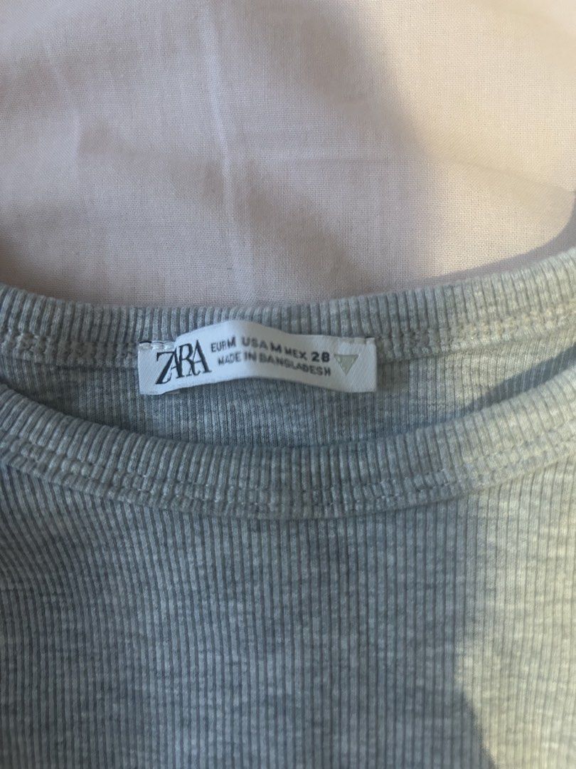 Zara grey tank top (Category: Sleeveless) located in Manila. Submitted by coquettecosette (Listing ID 1459729091, Image 2). Description: ୨୧ ˚₊‧ Grey Zara tank top ‧₊˚ ୨୧ ♡ Size: Medium ♡ Soft grey color ♡ Simple + feminine fit ♡ Easy to style with skirts, jeans, or low-rise bottoms ♡ Perfect for a cute coquette / ballet-inspired look 🎀🩰 𐙚 Great for everyday wear or layering ♡.