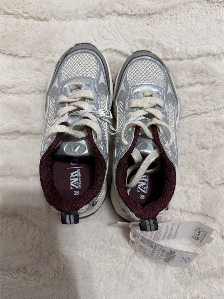Zara Kids Sneakers (Category: Babies & Kids Fashion) located in Cebu City. Submitted by sipandshopcebu (Listing ID 1459837825, Image 3). Description: ✨ BRAND NEW / NEVER WORN — WITH TAGS Zara kids sneakers in a metallic silver/grey with burgundy details. Super cute and easy to style — great for everyday wear. • Brand: ZARA • Size: EU 28 / US 11 / UK 10 • Color: Metallic silver/grey + burgundy • Condition: Brand new, never worn • Original tags att