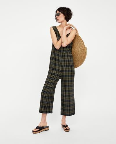 Zara Plaid Sleeveless Jumpsuit (Category: Jumpsuits) located in Davao. Submitted by parenasnic86577 (Listing ID 1459719707, Image 2). Description: - Zara plaid jumpsuit - Sleeveless with V-neck - Button front detail - Wide leg style - Estimated size: Small to Medium - Ideal for casual outings.