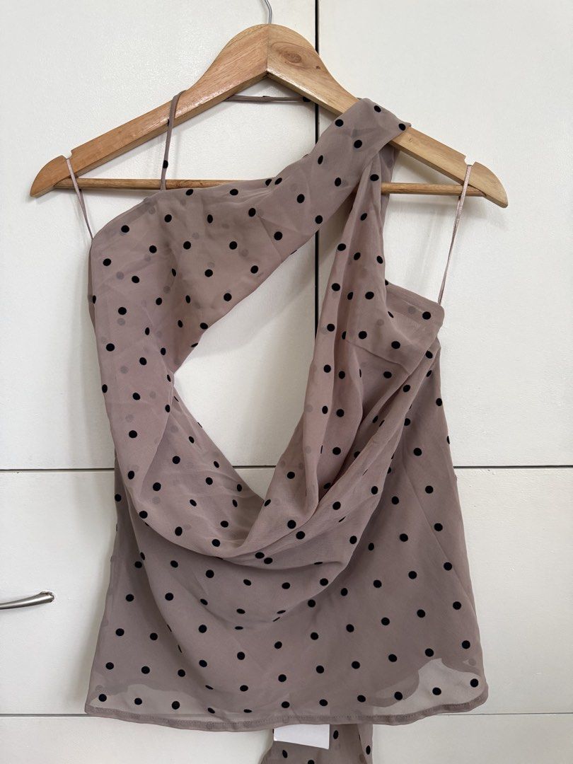 Zara Polka Dot Cowl Neck Halter Top (Category: Sleeveless) located in Pasig City. Submitted by helpmedispose (Listing ID 1459731341, Image 3). Description: - Beige halter top with black polka dots - Elegant cowl neck design - Ties at the back of the neck - Sheer fabric for a delicate look - Versatile: pairs well with jeans or can be dressed up - Very chic and stylish.