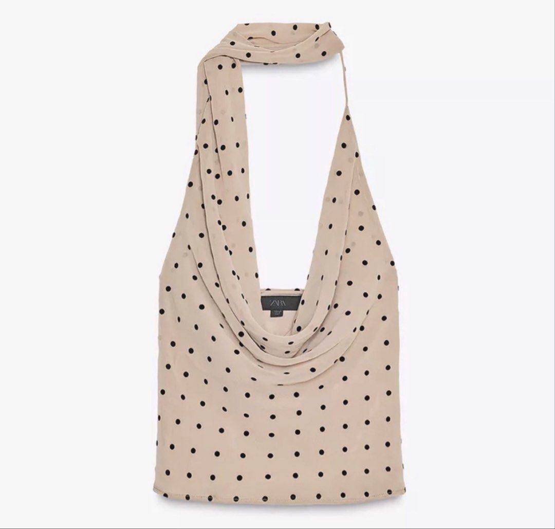 Zara Polka Dot Cowl Neck Halter Top (Category: Sleeveless) located in Pasig City. Submitted by helpmedispose (Listing ID 1459731341, Image 2). Description: - Beige halter top with black polka dots - Elegant cowl neck design - Ties at the back of the neck - Sheer fabric for a delicate look - Versatile: pairs well with jeans or can be dressed up - Very chic and stylish.