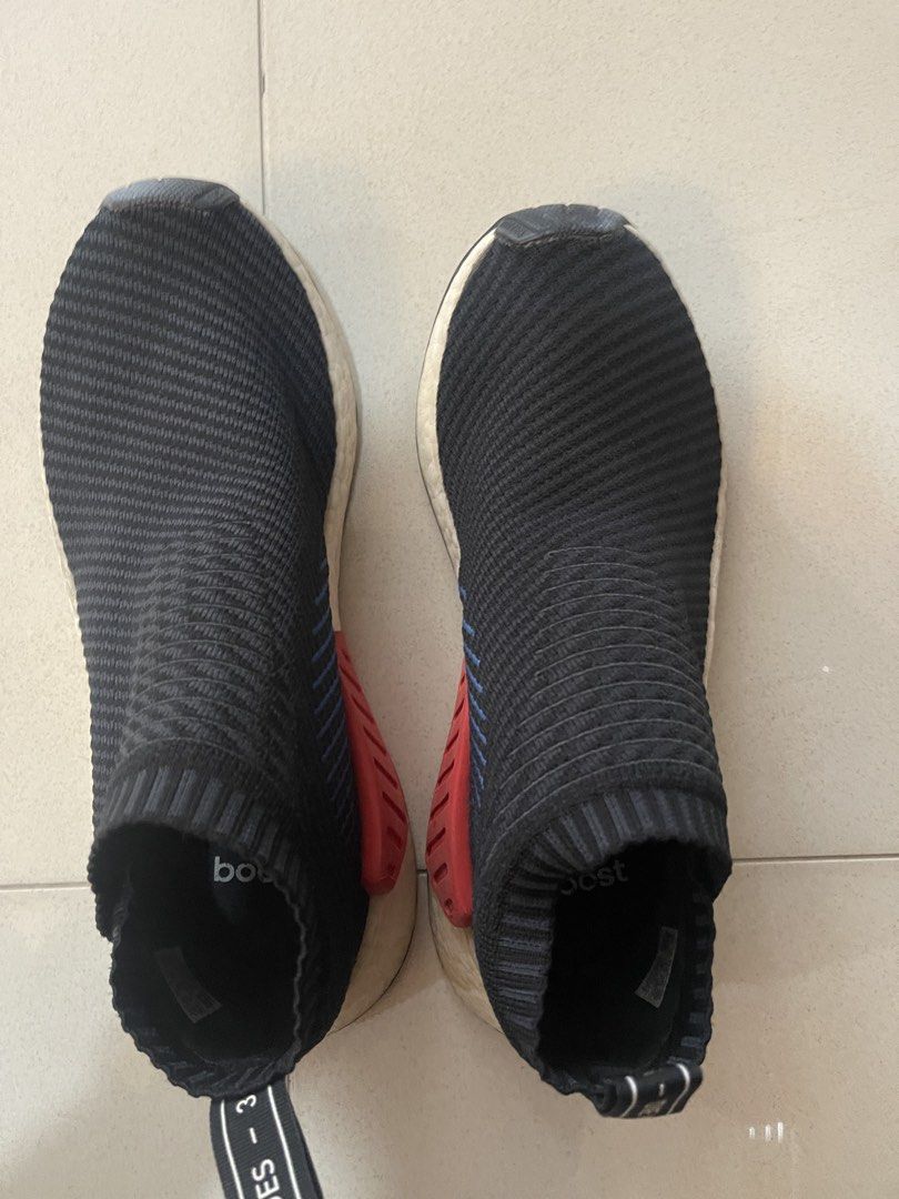 100% AUTHENTIC Adidas NMD City socks (Category: Sneakers) located in Manila. Submitted by le016392 (Listing ID 1459920881, Image 2). Description: - Adidas NMD City socks - Color: Black knit upper with blue stripes and red heel tab - Sole: Boost for ultimate comfort - Size: 8.5 US Men's - pre-loved: no longer using.