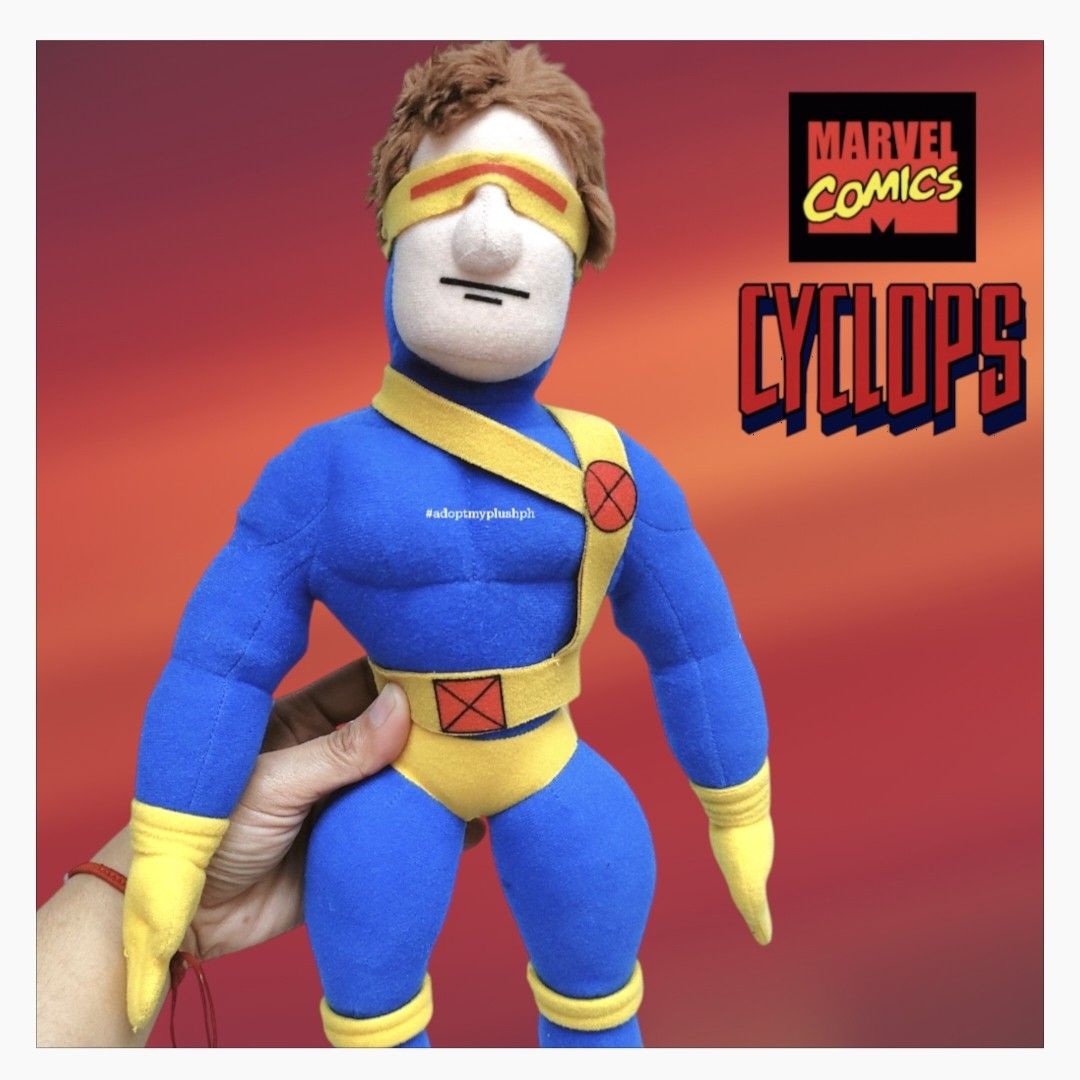 17" Kellytoy Marvel X-Men Cyclops Plush Figure (Category: Plushies & Soft Toys) located in Taguig. Submitted by adopt.my.plush.ph (Listing ID 1459915323, Image 1). Description: Character: Cyclops (Scott Summers) from Marvel's X-Men. Design Era: This specific muscular, streamlined plush design belongs to the Ultimate Marvel comic line aesthetic launched in the early 2000s. It features his signature ruby-quartz visor, a blue bodysuit, yellow boots,