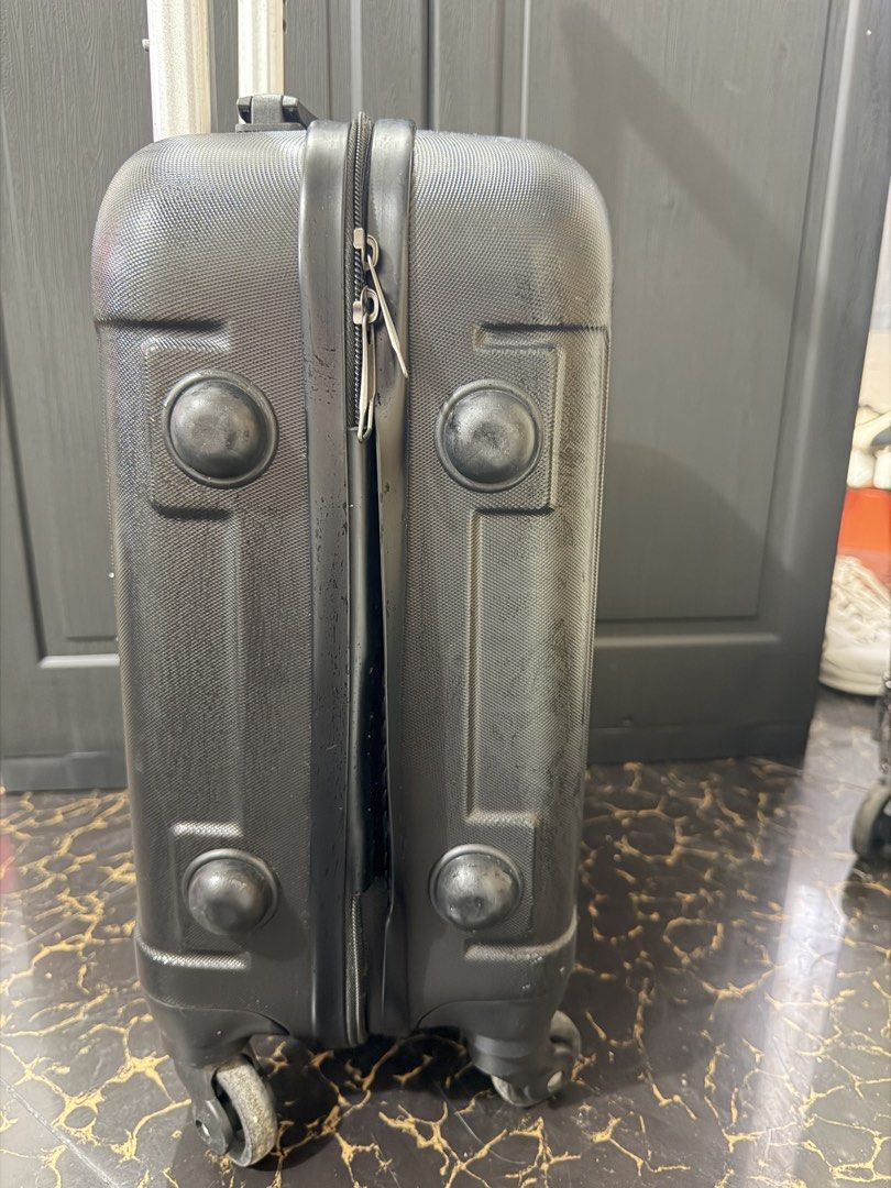 18 inches Black Hardshell Cabin Suitcase with TSA Lock (Category: Luggage) located in Bacoor. Submitted by everything_etc. (Listing ID 1460040106, Image 3). Description: - Black hardshell suitcase - Built-in TSA combination lock - Four spinner wheels for easy rolling - Retractable handle - Minor scuffs and scratches from normal use - Ideal for short trips or carry-on.