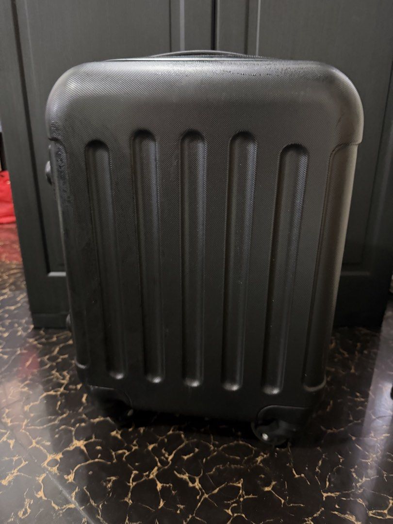 18 inches Black Hardshell Cabin Suitcase with TSA Lock (Category: Luggage) located in Bacoor. Submitted by everything_etc. (Listing ID 1460040106, Image 1). Description: - Black hardshell suitcase - Built-in TSA combination lock - Four spinner wheels for easy rolling - Retractable handle - Minor scuffs and scratches from normal use - Ideal for short trips or carry-on.