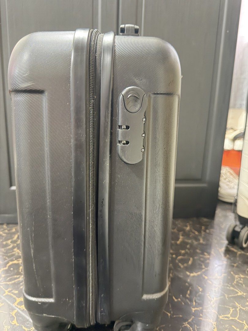 18 inches Black Hardshell Cabin Suitcase with TSA Lock (Category: Luggage) located in Bacoor. Submitted by everything_etc. (Listing ID 1460040106, Image 2). Description: - Black hardshell suitcase - Built-in TSA combination lock - Four spinner wheels for easy rolling - Retractable handle - Minor scuffs and scratches from normal use - Ideal for short trips or carry-on.