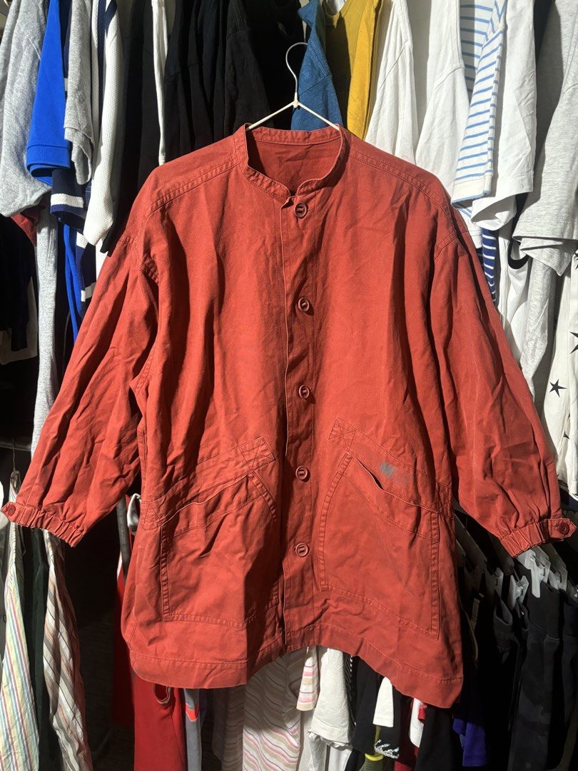 1980s Archival Issey Miyake Red Button-Up jacket (Category: Coats, Jackets and Outerwear) located in Manila. Submitted by why_notph (Listing ID 1460100839, Image 1). Description: - Red jacket from MIYAKE DESIGN STUDIO - Features a stylish mandarin collar - Button-up front closure - Three functional pockets: two large front pockets and one smaller chest pocket - Elasticated cuffs with button detail for a snug fit - Made from durable fabric - Versa